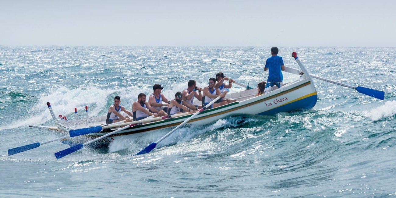 group of men riding boat